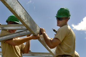 Constrution workers, working outdoors. 