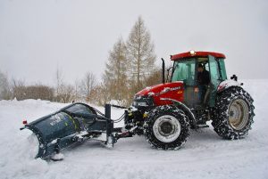 Tractor being used as a part of a snow removal business. 