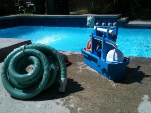 Swimming Pool Maintenance Equipment on the side of a pool. 