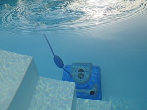 Swimming Pool Cleaner operating underwater. 