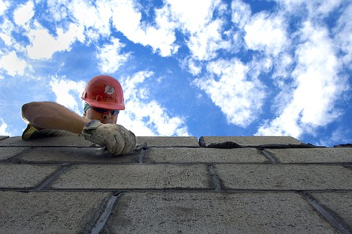 Masonry Business installing bricks.